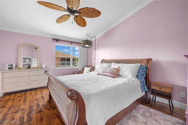 bedroom with ceiling fan, dark hardwood / wood-style flooring, and crown molding