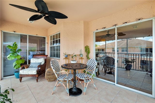 view of patio with a balcony and ceiling fan