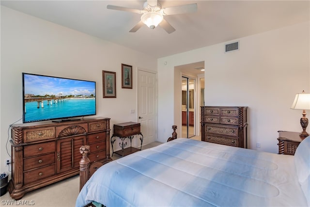 bedroom featuring connected bathroom, visible vents, a ceiling fan, and light colored carpet