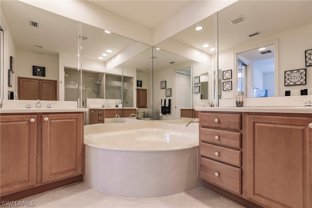 bathroom featuring a garden tub, recessed lighting, visible vents, and tile patterned floors