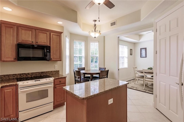 kitchen with light tile patterned floors, a raised ceiling, visible vents, electric range, and black microwave