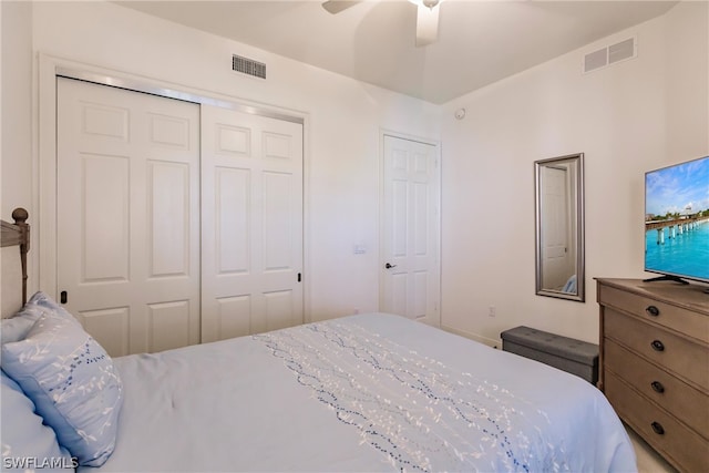 bedroom featuring ceiling fan, visible vents, and a closet