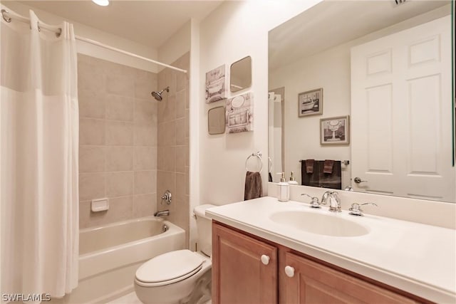 bathroom with shower / bath combo, vanity, and toilet