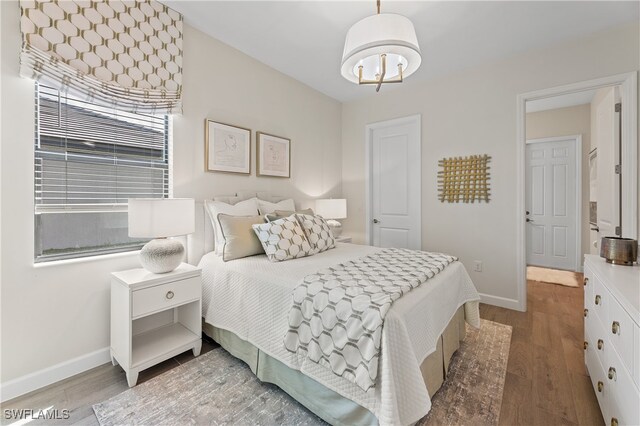 bedroom featuring wood-type flooring