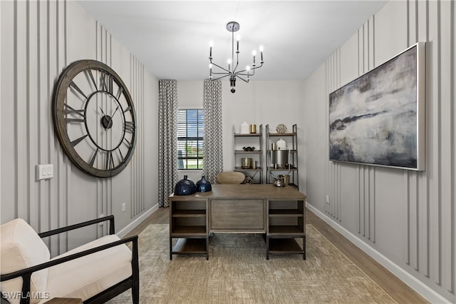 office featuring hardwood / wood-style flooring and a chandelier