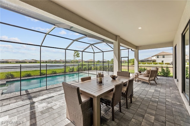 view of patio / terrace with a lanai, an outdoor pool, and an outdoor living space