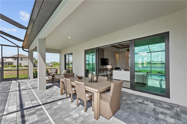 view of patio / terrace with a lanai