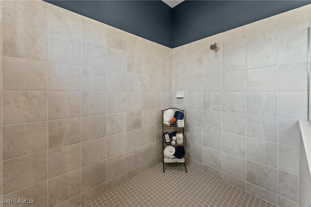 bathroom with a tile shower