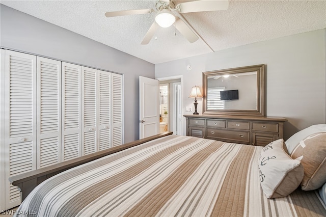 bedroom with ceiling fan, a closet, and a textured ceiling