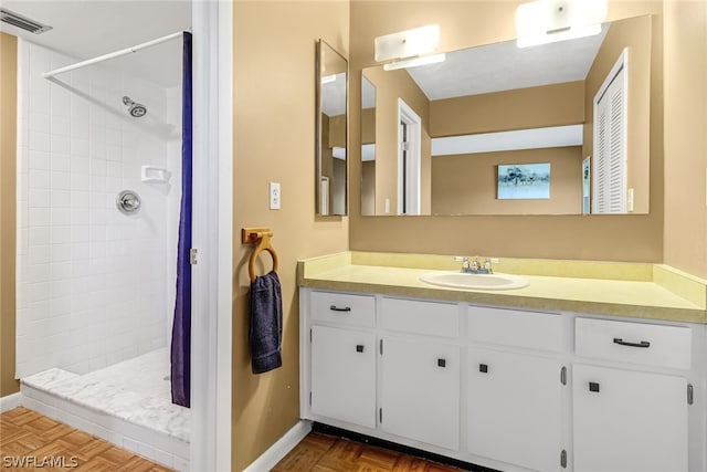 bathroom with a shower with curtain, parquet floors, and vanity