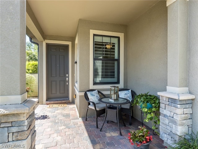 property entrance with a patio area