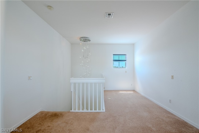 unfurnished room with carpet flooring