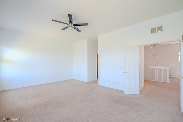 empty room featuring ceiling fan and carpet flooring