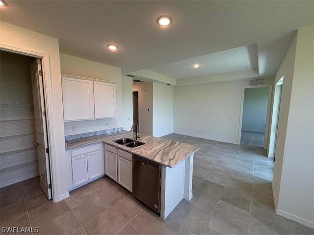 kitchen featuring kitchen peninsula, sink, white cabinets, and stainless steel dishwasher