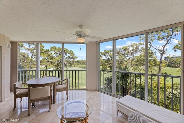 sunroom / solarium with ceiling fan