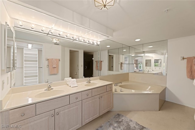 bathroom with a tub to relax in and vanity