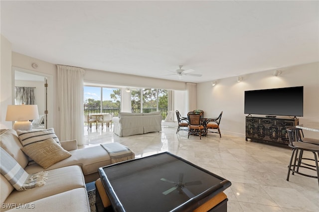 living room featuring tile patterned flooring and ceiling fan