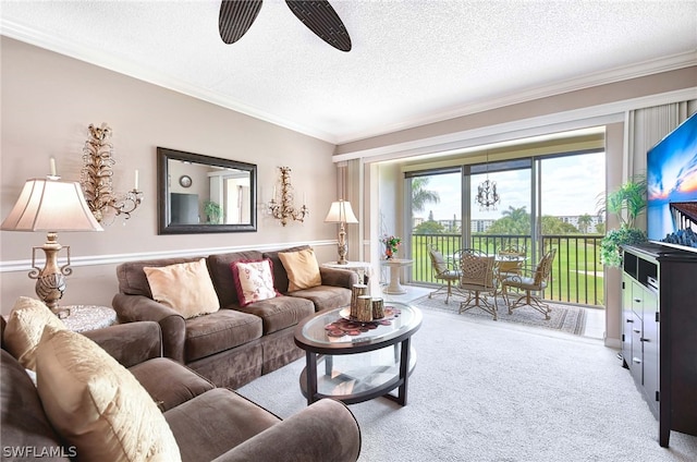 living room featuring ornamental molding, a textured ceiling, ceiling fan, and carpet floors