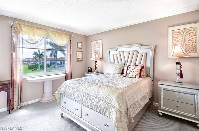 bedroom featuring ornamental molding, carpet flooring, and a textured ceiling