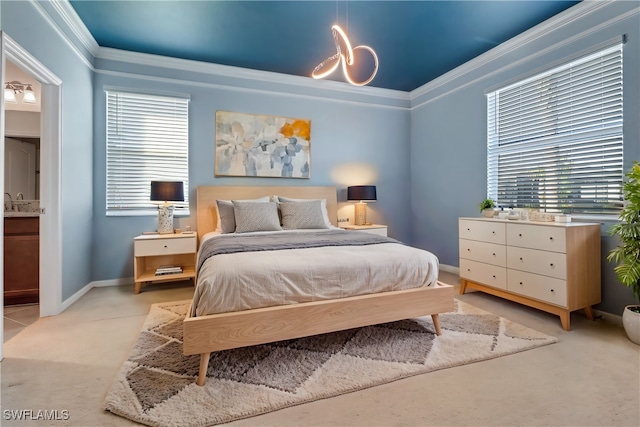 carpeted bedroom with crown molding, multiple windows, and ensuite bath