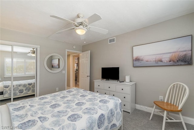 bedroom with a closet, light colored carpet, and ceiling fan