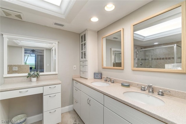 bathroom with ceiling fan, tile patterned floors, an enclosed shower, vanity, and ornamental molding