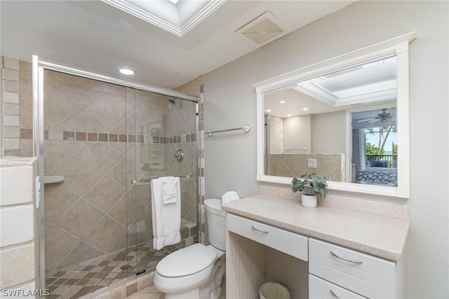 bathroom featuring walk in shower, crown molding, vanity, and toilet