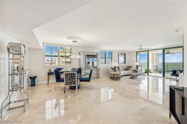 tiled living room with ceiling fan