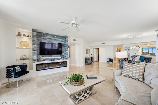 tiled living room featuring ceiling fan and built in features