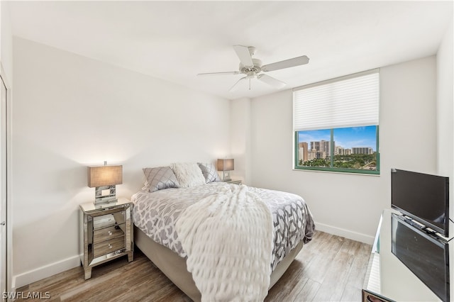 bedroom featuring hardwood / wood-style floors and ceiling fan