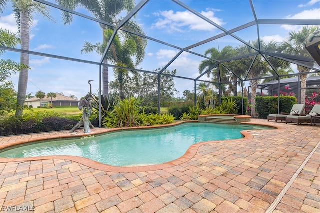 view of pool featuring an in ground hot tub, a lanai, and a patio