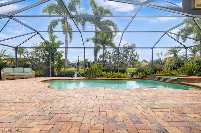 view of pool with an outdoor living space, an in ground hot tub, a patio, and a lanai