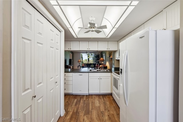 kitchen with ceiling fan, sink, white appliances, white cabinetry, and dark wood-type flooring