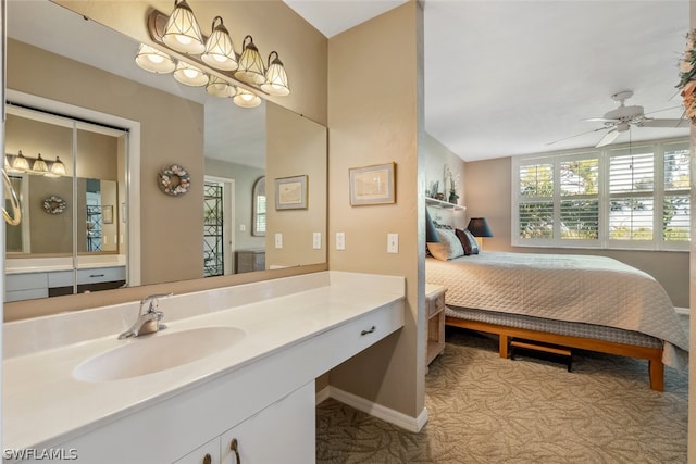 bathroom with ceiling fan and vanity