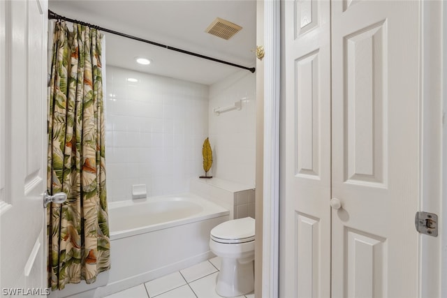 bathroom featuring shower / tub combo, tile floors, and toilet