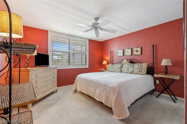 bedroom with ceiling fan and carpet floors