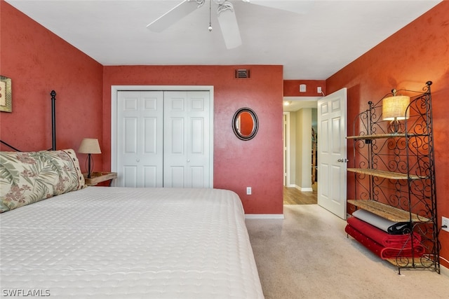 bedroom featuring carpet, a closet, and ceiling fan