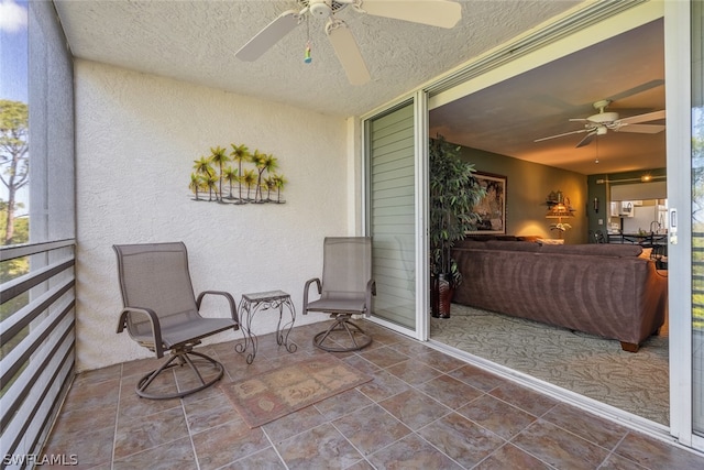 sunroom / solarium with ceiling fan