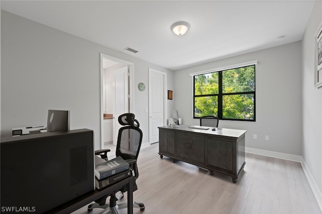 office space with light hardwood / wood-style floors