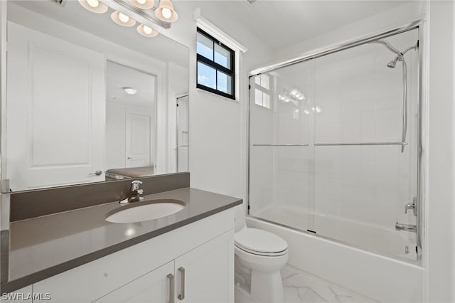 full bathroom with vanity, toilet, and bath / shower combo with glass door