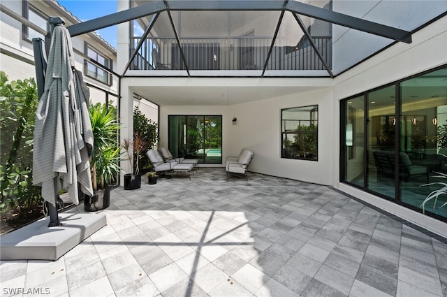 view of patio featuring a balcony