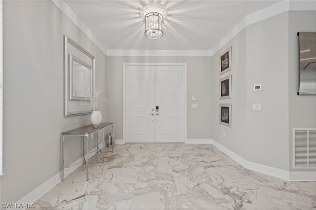 entrance foyer featuring a notable chandelier