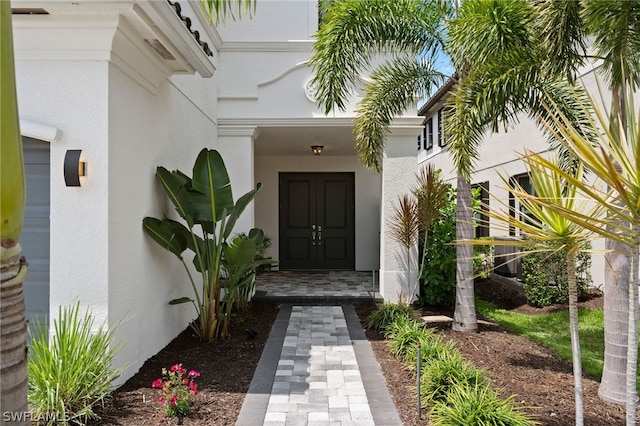 view of exterior entry with a porch