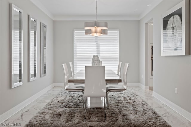 dining area featuring ornamental molding