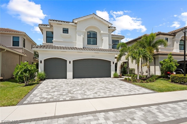 mediterranean / spanish home with a garage