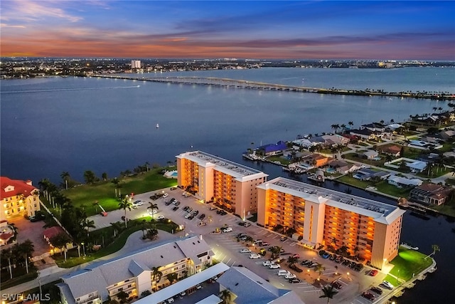 aerial view at dusk with a water view