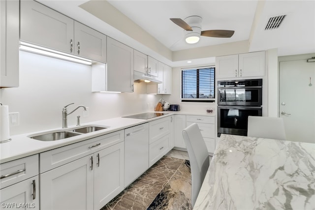 kitchen with dishwasher, sink, black electric cooktop, stainless steel double oven, and white cabinetry