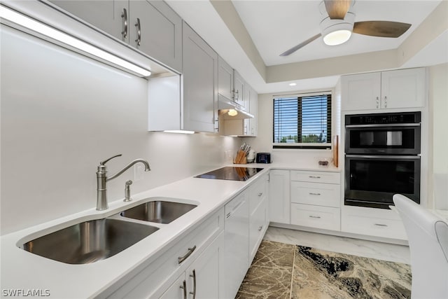 kitchen featuring dishwasher, black electric stovetop, stainless steel double oven, sink, and white cabinetry