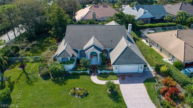 view of front of property with a front lawn and a garage