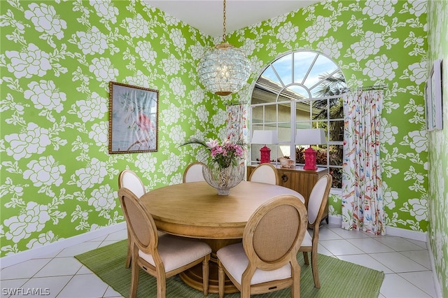 dining space with tile flooring